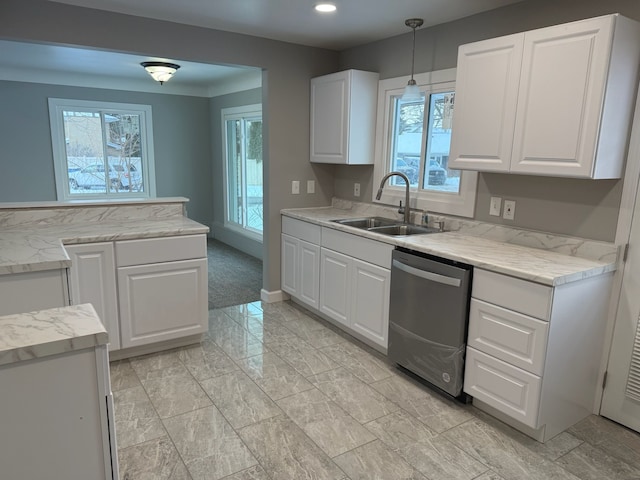 kitchen featuring stainless steel dishwasher, sink, and white cabinets