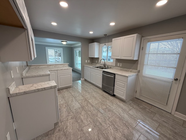 kitchen featuring sink, white cabinetry, decorative light fixtures, dishwasher, and kitchen peninsula