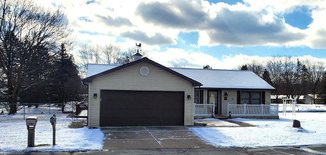 view of front of property with a porch and a garage