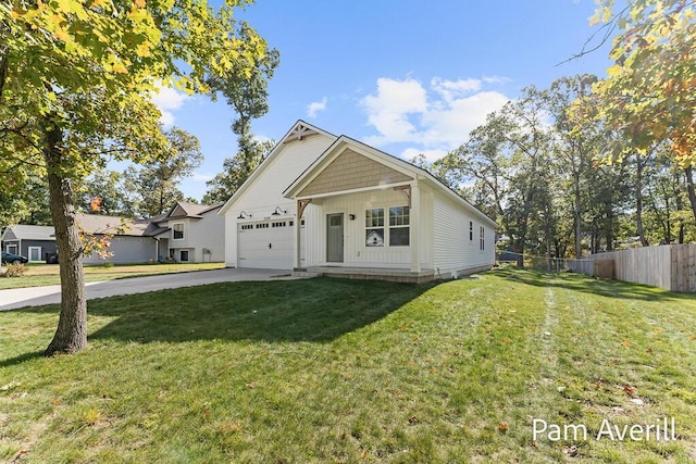 view of front of home with a garage and a front lawn