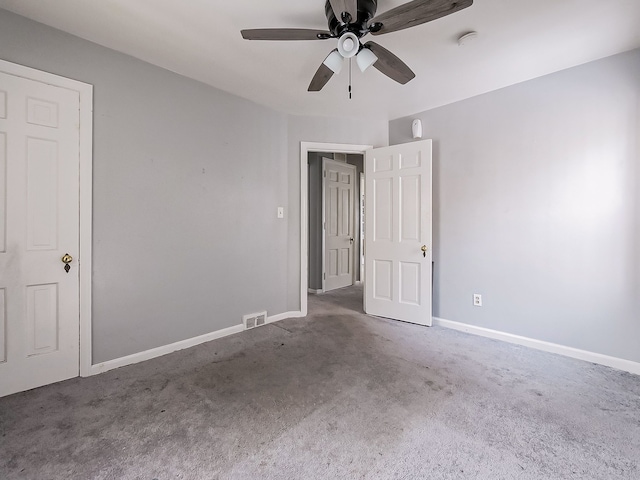 spare room featuring carpet flooring and ceiling fan