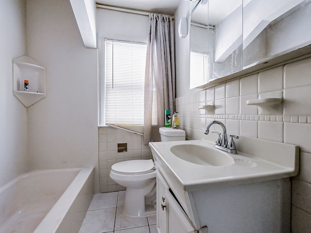 bathroom featuring vanity, tile patterned floors, tile walls, and toilet