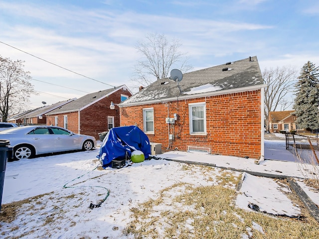 view of snow covered house