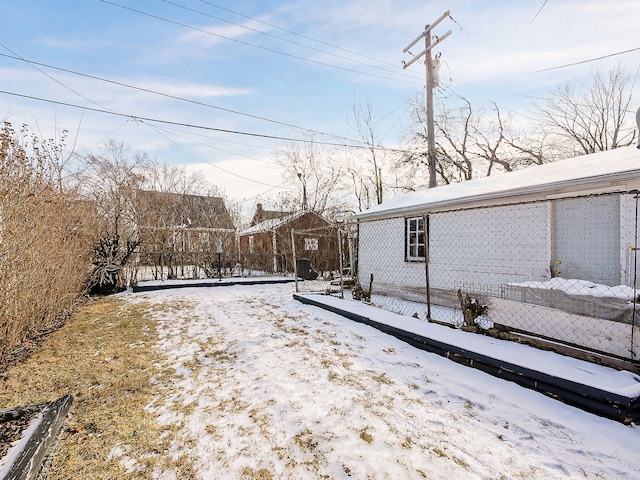 view of yard covered in snow