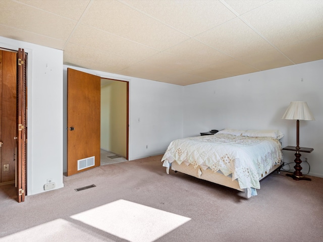 1397 N Channel Dr, Harsens Island, MI 48028 - carpeted bedroom with a paneled ceiling
