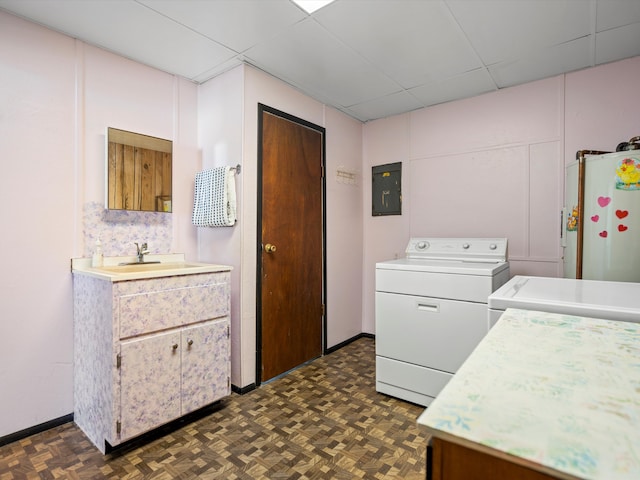 1397 N Channel Dr, Harsens Island, MI 48028 - laundry area featuring washing machine and clothes dryer, electric panel, and baseboards