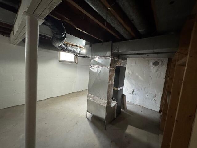 basement featuring heating unit