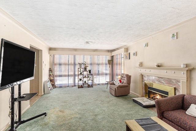 living room with ornamental molding, carpet flooring, a textured ceiling, and a high end fireplace