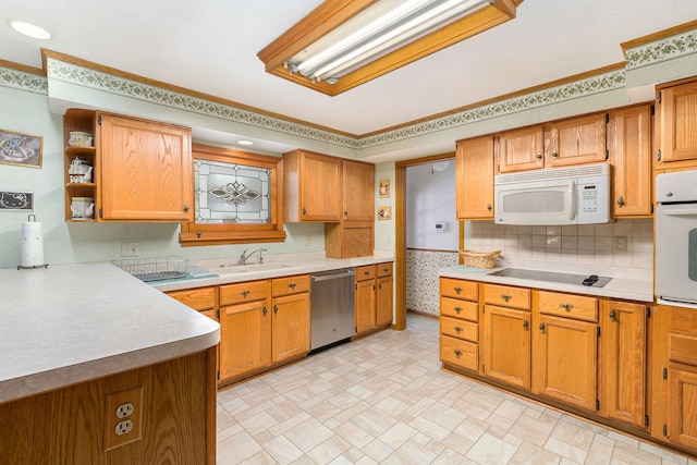 kitchen with crown molding, sink, and white appliances