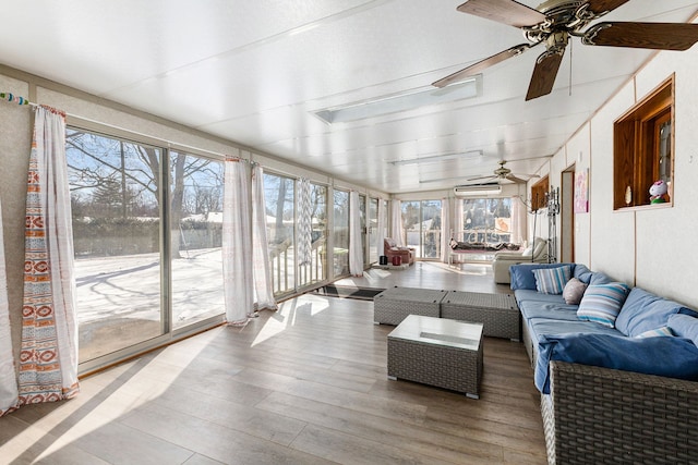 sunroom featuring an AC wall unit