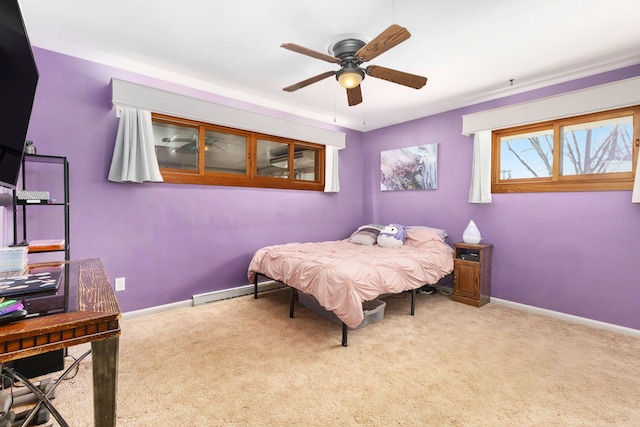 bedroom featuring light colored carpet and ceiling fan