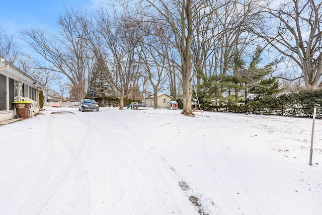 view of yard layered in snow