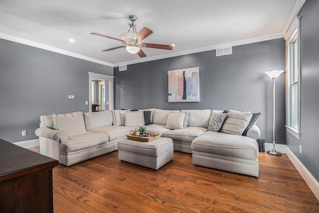 living room featuring crown molding, ceiling fan, and dark wood-type flooring