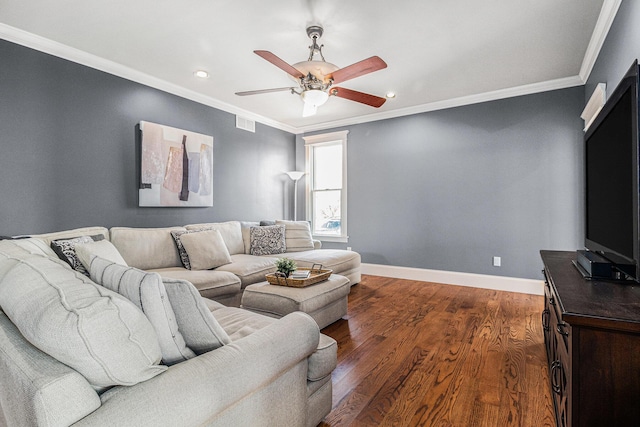 living room featuring ceiling fan, ornamental molding, and dark hardwood / wood-style floors