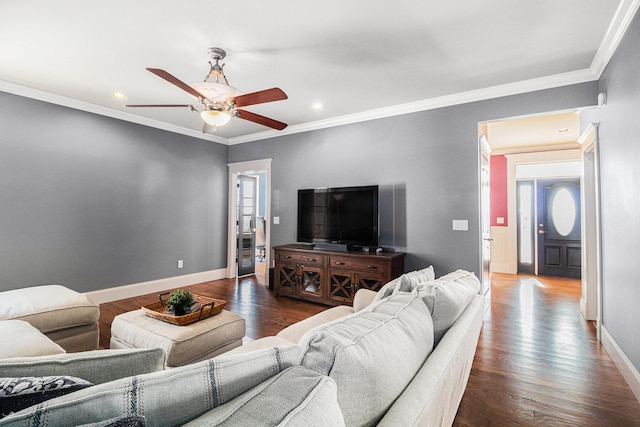 living room with crown molding, ceiling fan, and dark hardwood / wood-style flooring