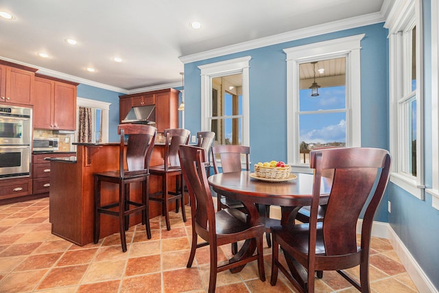 dining room with crown molding