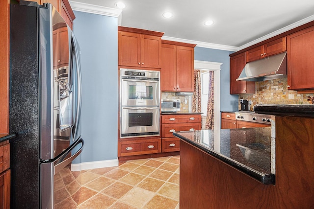 kitchen with dark stone countertops, backsplash, crown molding, and appliances with stainless steel finishes