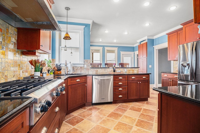 kitchen featuring sink, appliances with stainless steel finishes, island range hood, ornamental molding, and decorative light fixtures