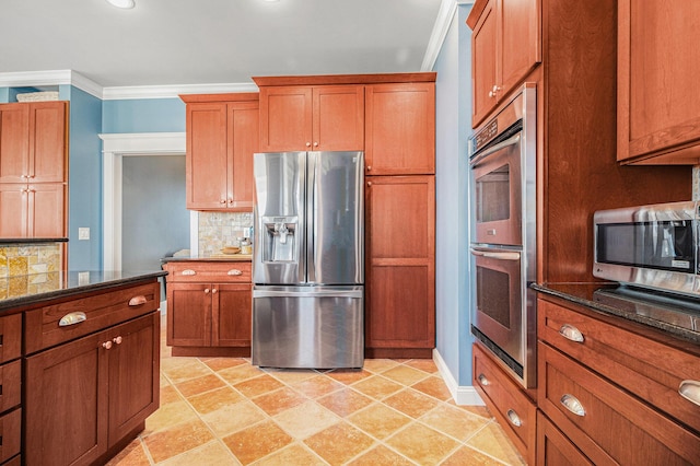 kitchen with backsplash, ornamental molding, stainless steel appliances, and dark stone counters