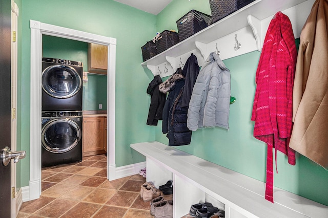 mudroom featuring stacked washer / drying machine