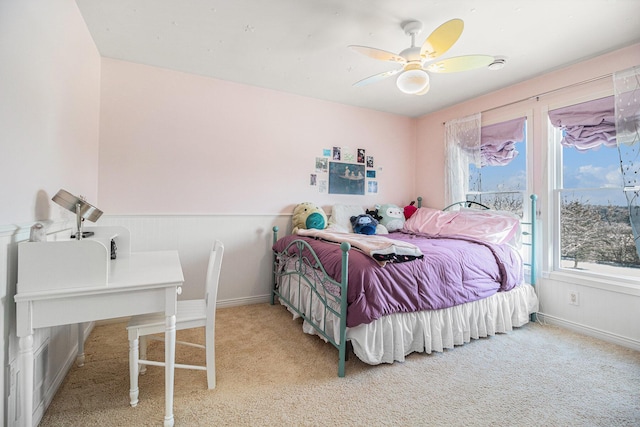 bedroom featuring ceiling fan and light colored carpet