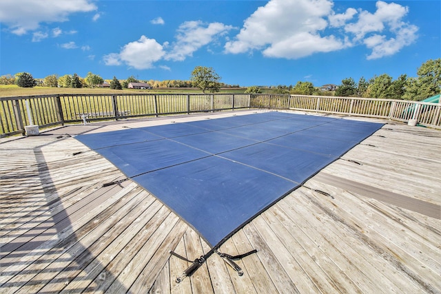 view of swimming pool featuring a deck