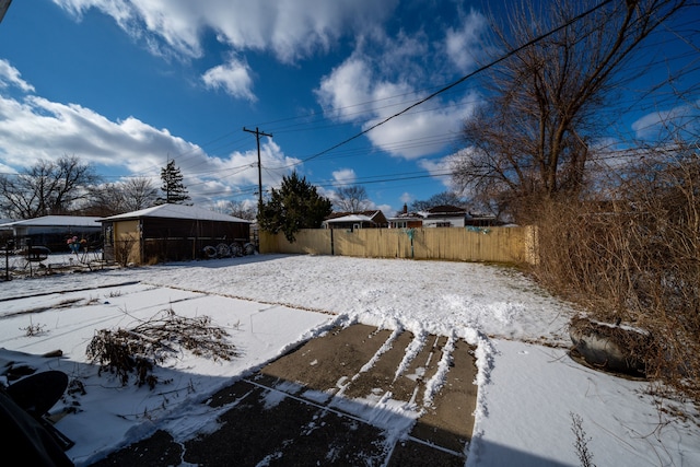 view of yard covered in snow