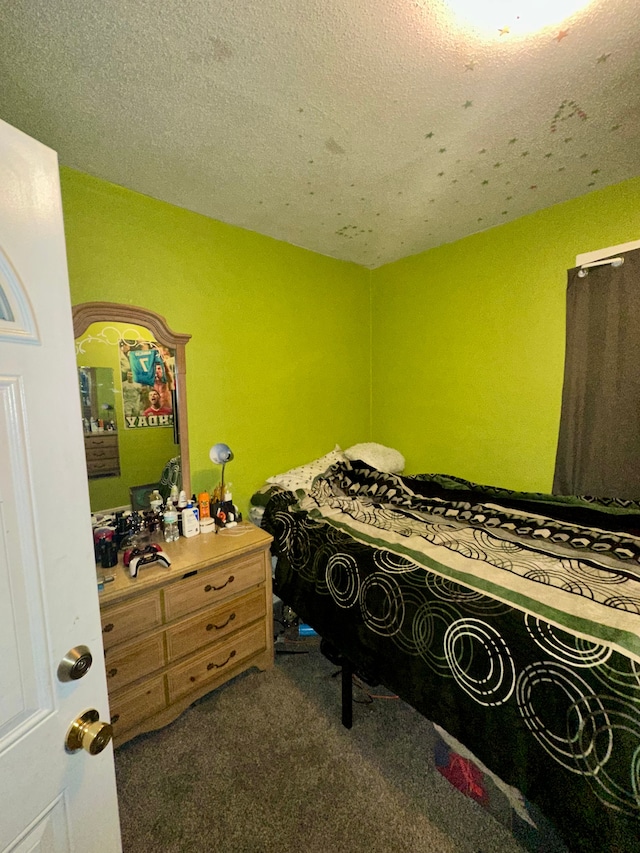 carpeted bedroom with a textured ceiling