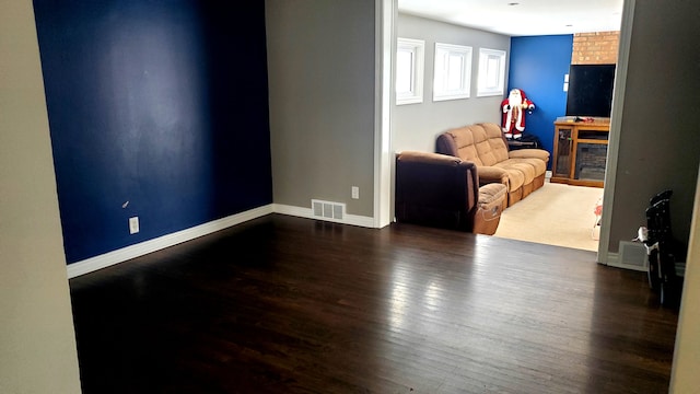 living room featuring dark hardwood / wood-style floors