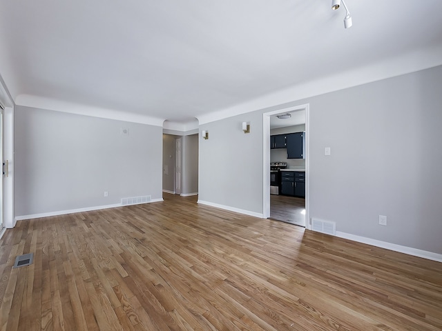 unfurnished living room with light hardwood / wood-style floors