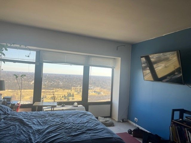 bedroom featuring carpet flooring and baseboards