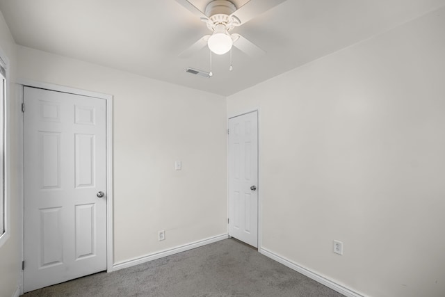 unfurnished bedroom featuring carpet floors and ceiling fan