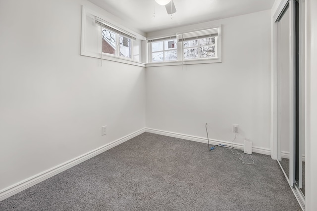 carpeted empty room with ceiling fan