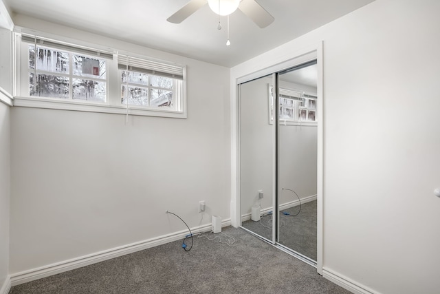 unfurnished bedroom featuring a closet, ceiling fan, and carpet