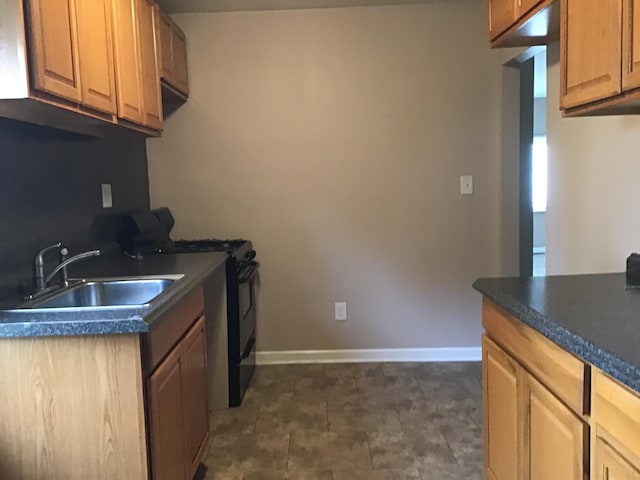 kitchen featuring sink and black range with gas stovetop