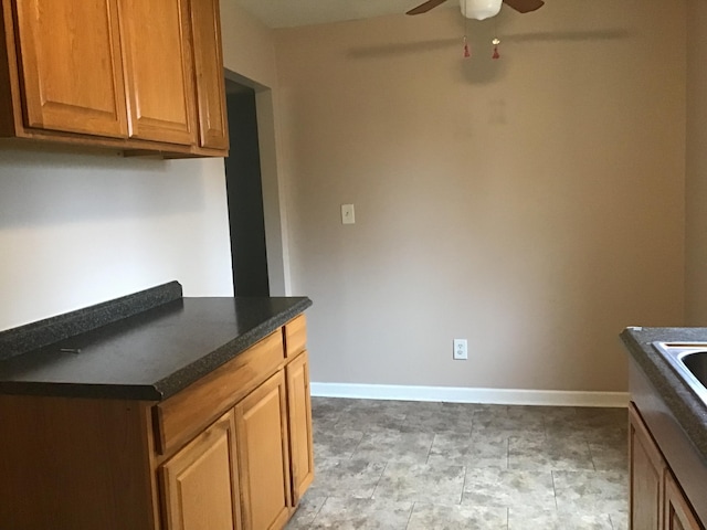 kitchen featuring ceiling fan