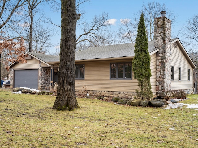 view of front of house featuring a front lawn, a shingled roof, a chimney, and an attached garage