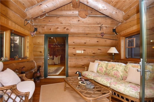 interior space featuring lofted ceiling and hardwood / wood-style flooring