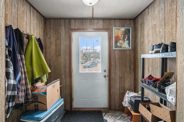 mudroom featuring wood walls