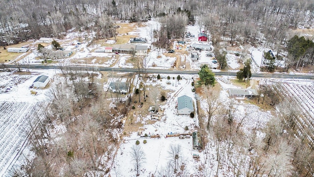 snowy aerial view featuring a rural view