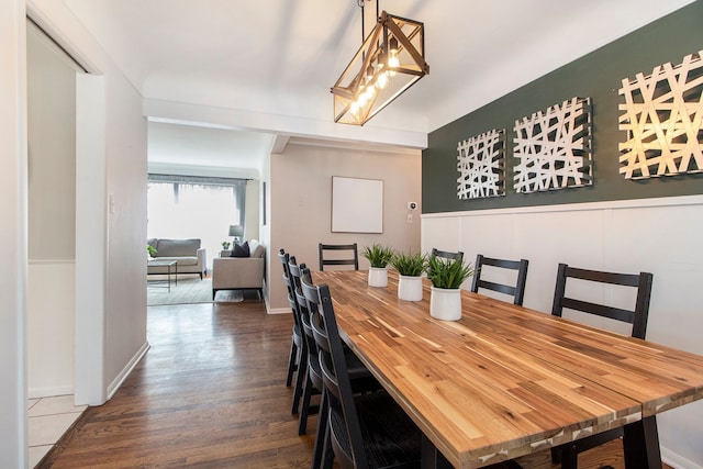 dining space featuring wood finished floors