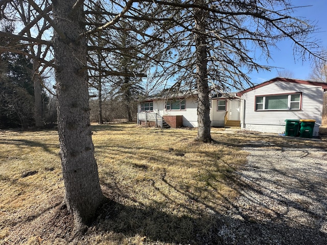 view of yard with entry steps