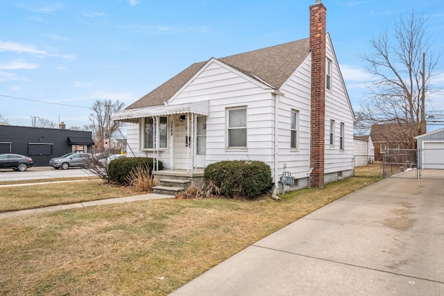 bungalow-style house featuring a front yard