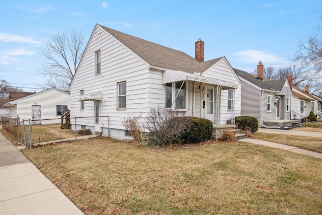 bungalow-style home featuring a front lawn