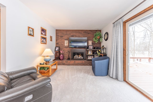 carpeted living room with a brick fireplace and a healthy amount of sunlight