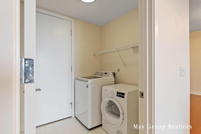 clothes washing area featuring washer and dryer