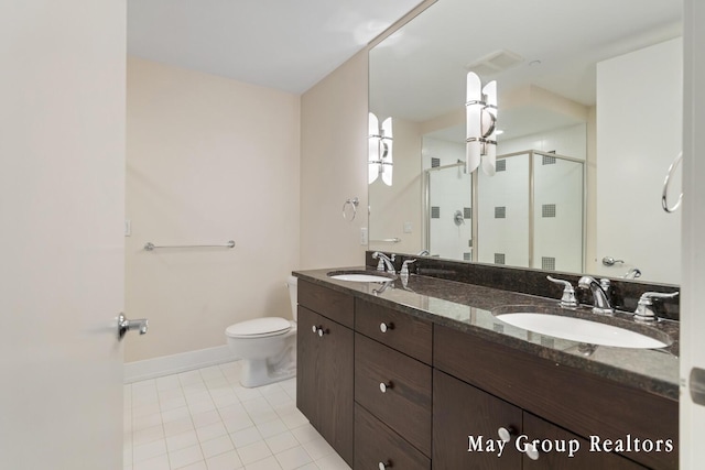 bathroom with vanity, toilet, an enclosed shower, and tile patterned flooring