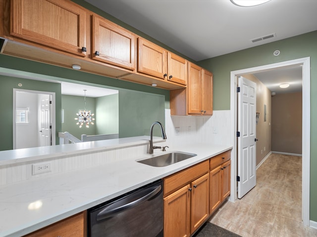 kitchen with an inviting chandelier, sink, backsplash, black dishwasher, and decorative light fixtures