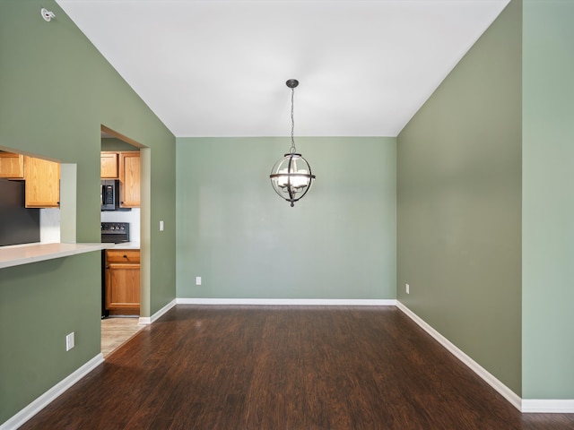 unfurnished dining area featuring hardwood / wood-style flooring, vaulted ceiling, and a notable chandelier