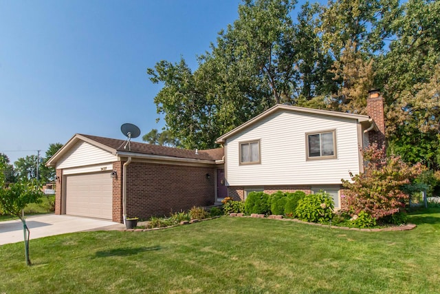 split level home with a garage and a front lawn